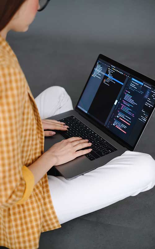 Coder working on laptop